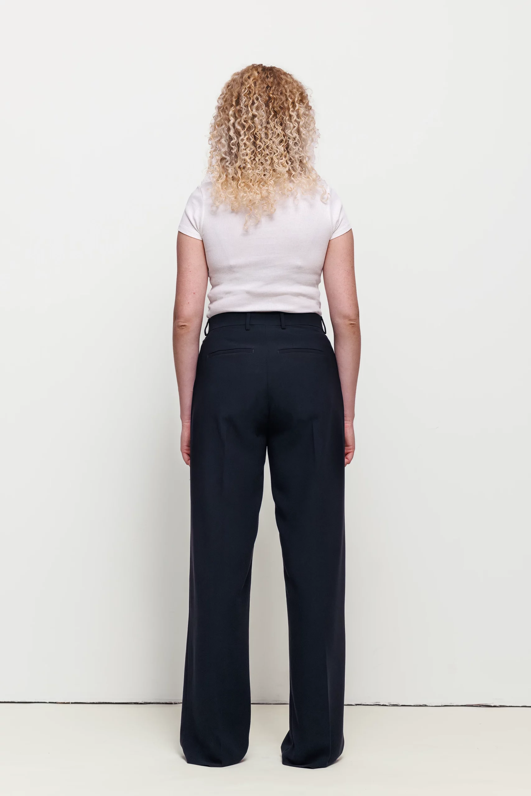a woman with curly blonde hair