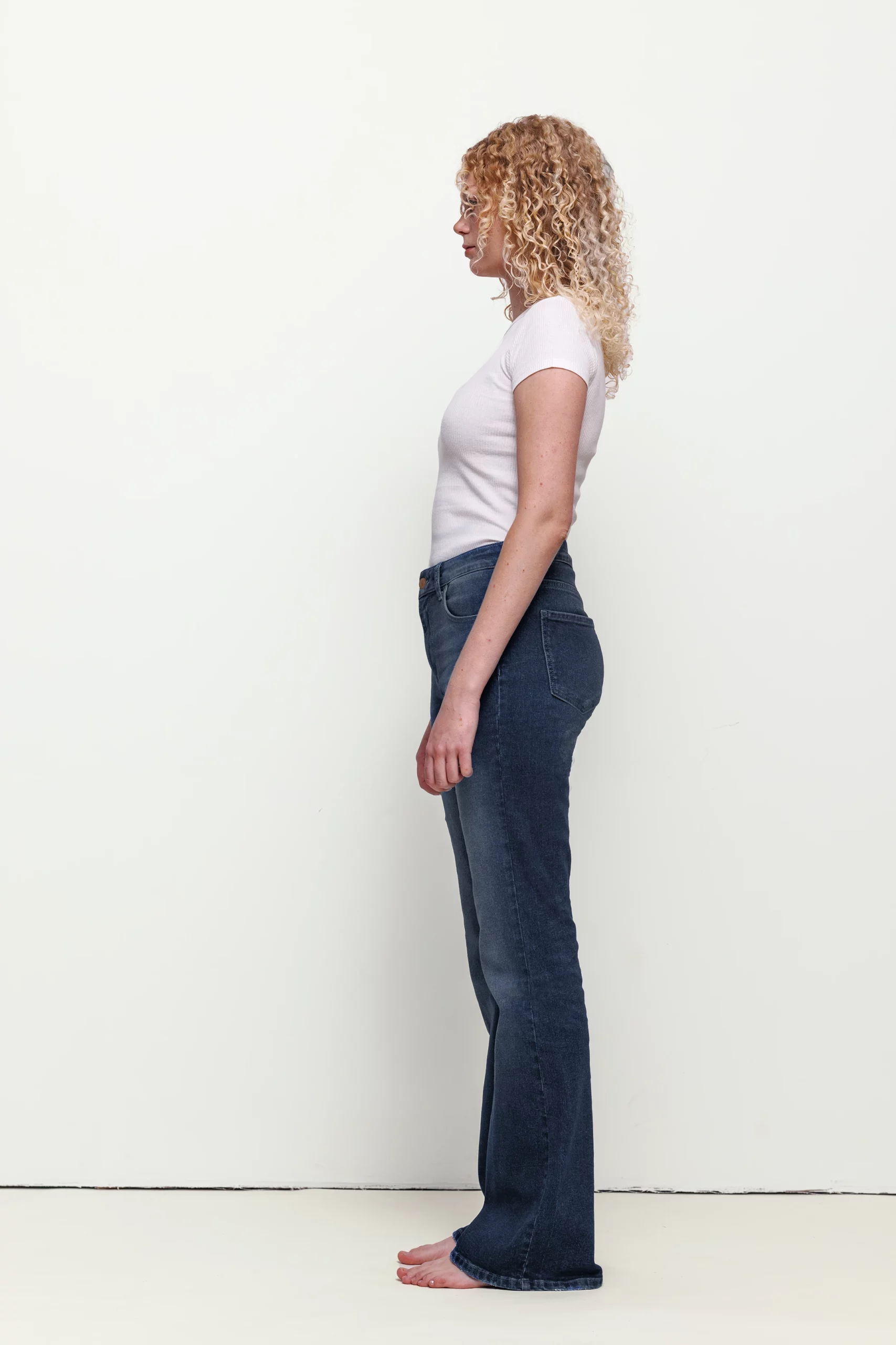 a woman with curly blonde hair