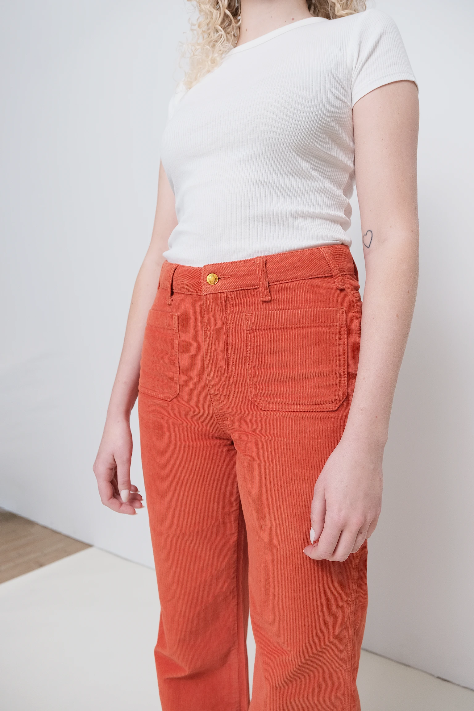 a person wearing orange pants