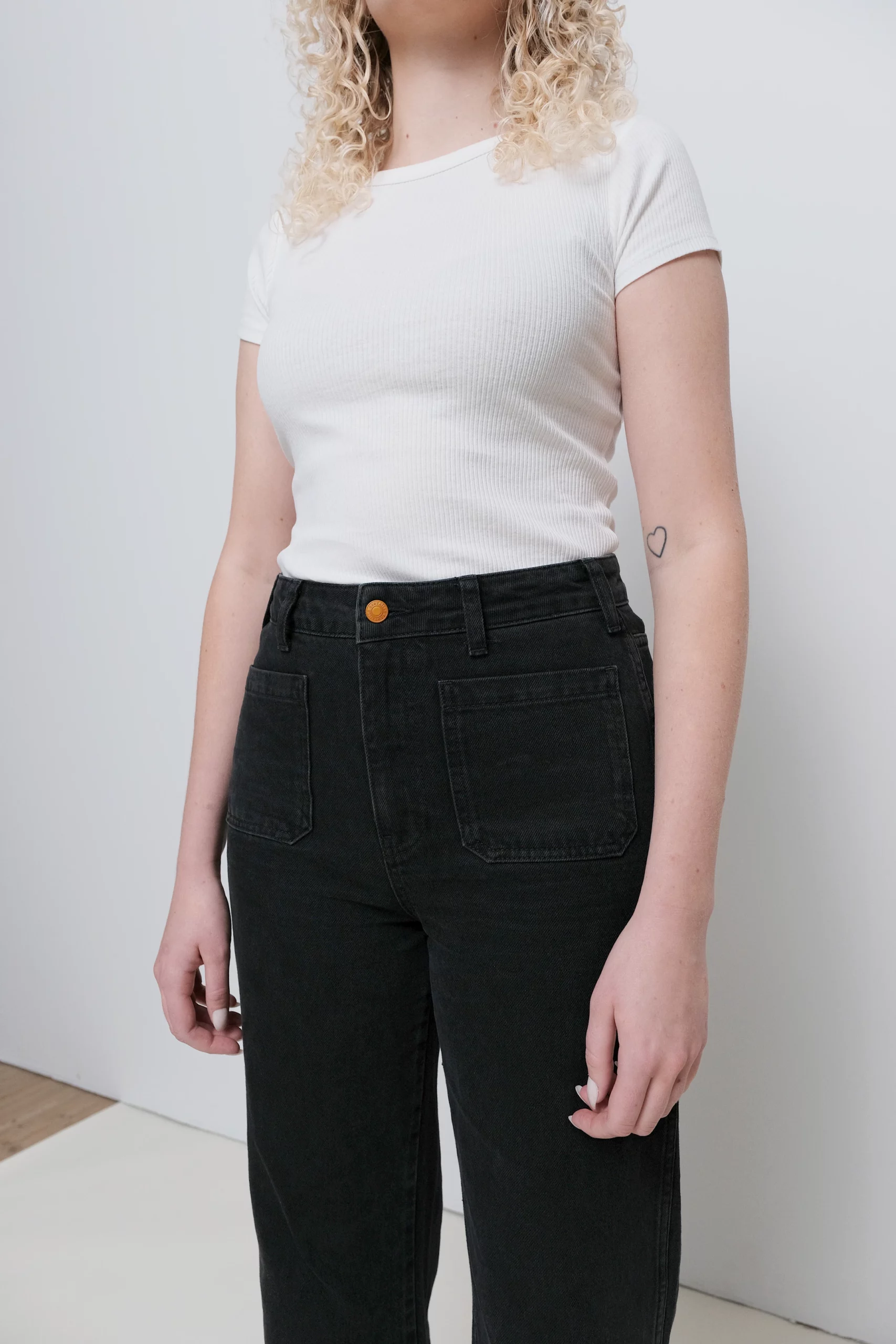 a woman wearing black jeans