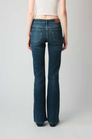 Girl wearing blue denim jeans with extra long legs