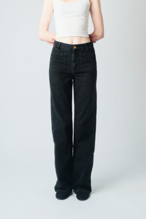 Girl wearing black denim pants with extra long legs